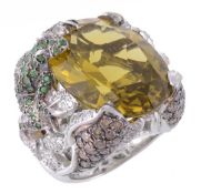 A multi gem set frog ring, the central oval shaped prasiolite within a surround of openwork foliate