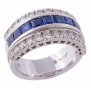 A sapphire and diamond band ring, the central row of square shaped sapphires between two rows of
