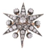 A Victorian diamond star brooch, circa 1880, the old cut diamonds in gold backed silver settings,