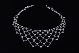 A sapphire fringe bib necklace, the collet set sapphires linked by belcher link chains to form a