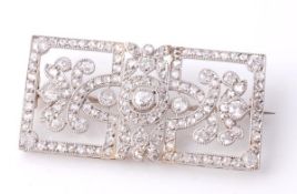An Edwardian diamond brooch, circa 1910, the pierced rectangular plaque with an old brilliant and