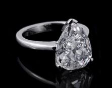 A pear shaped diamond ring, the pear shaped diamond, weighing 4.01 carats, in a three claw setting,