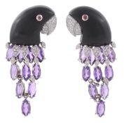 A pair of French diamond and amethyst parrot ear clips by L`Oree du Bois, with carved ebony heads