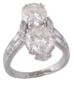 A two stone diamond ring, the brilliant cut diamonds weighing 2.30 carats and 1.20 carats, with