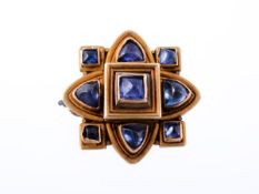 A mid 19th century gold and sapphire quatrefoil archeological revival brooch, circa 1865, the