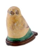 A Bilston enamel canary bonbonniere, circa 1775-80, the yellow bird perched on a green mound, the