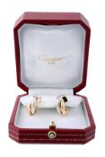 A pair of Trinity ear hoops by Cartier, the three colour entwinned hoops to stud and clip fittings,