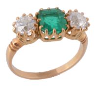 An emerald and diamond three stone ring, the central square shaped emerald in a claw setting,