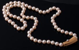 A cultured pearl necklace, the seventy two uniform cultured pearls measuring 8.1mm, to a hammered