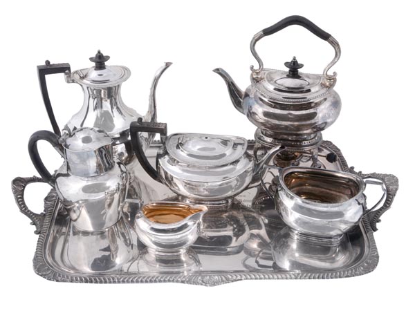 An Edwardian silver tea and coffee service on a tray by Atkin Brothers, Sheffield 1901, of oval