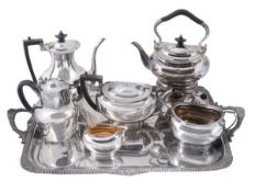 An Edwardian silver tea and coffee service on a tray by Atkin Brothers, Sheffield 1901, of oval