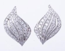 A pair of diamond ear clips, the leaf shape ear clips set throughout with brilliant cut diamonds,