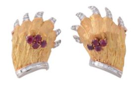 A pair of French diamond and ruby paw ear clips, centrally set with a cluster of circular shaped