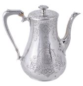 A Victorian silver baluster coffee pot by William Hunter, London 1855, with a button finial to the
