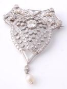 A Belle Epoque diamond set brooch, circa 1910, the shaped brooch with a central brilliant cut