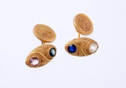 A pair of multi gem cufflinks by Tiffany & Co, the early 20th century oval front panels inset with