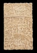 A Chinese export ivory rectangular card case, Macau circa 1860, carved overall with figures in a