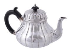 A Victorian silver lobed melon shape tea pot by R. & S. Garrard & Co., London 1849, with a
