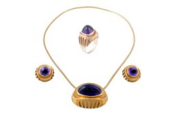 An amethyst suite of jewellery, comprising a single stone ring, set with a sugarloaf cabochon
