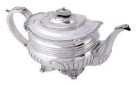 A late George III silver oblong baluster tea pot by Richard Pearce, London 1817, with a gadrooned