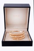 A gold coloured Spiga bracelet by Bulgari, the polished chevron links with intermittent broader