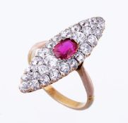 A late Victorian ruby and diamond ring, circa 1900, the marquise shaped panel set with a central