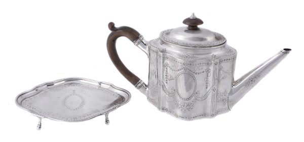 A George III silver commode shape straight-sided tea pot and an associated stand, the tea pot by