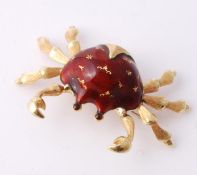 An enamel crab brooch, with a red enamel body and textured claws, stamped 750 with Italian control