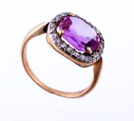 A pink topaz and diamond ring, the square shaped fancy cut pink topaz in a four claw setting,