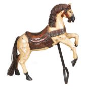 A polychrome painted wood fairground horse, late 19th / early 20th century, depicted standing on