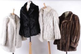 A collection of vintage coats and jackets, comprising: a Saga silver fox fur jacket; a brown and