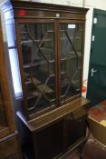 A George III style mahogany glazed bookcase 186cm high, 84cm wide