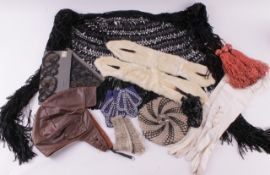 A collection of vintage textiles and accessories, including: a leather flying hat, a quantity of