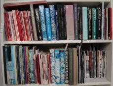 A quantity of books and theatre programmes on two shelves. There is no condition report available