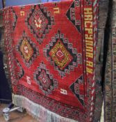 A Middle Eastern red ground rug approximately 299cm length, 170cm width There is no condition