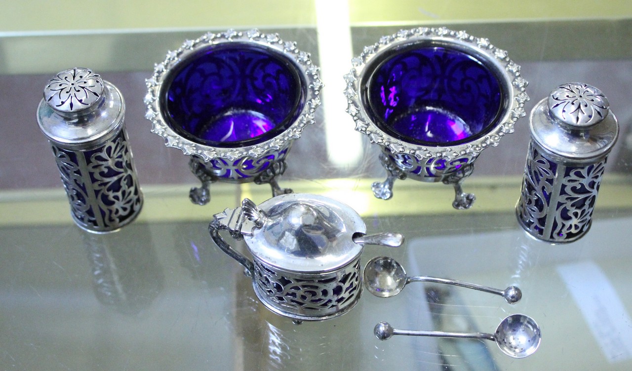 A pair of silver salts; together with a pair of silver pepperettes; and a silver mustard pot, (3).