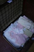 A suitcase of early 20th century children?s clothing: to include: dresses, nightgowns, a