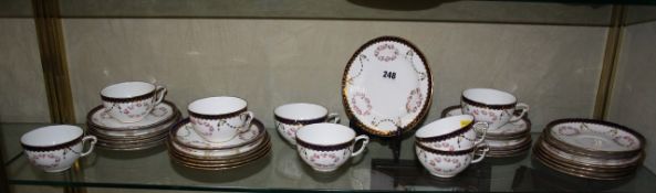 A Royal Crown Derby part tea service pink flowers and a blue and gold rim. There is no condition