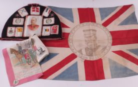 A commemorative tea cosy made from cigarette silks; together with an ivory coloured handkerchief