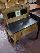 A late Victorian pine marble top washstand with inset tiles, a cupboard and on ring turned tapering