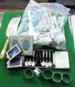 A small collection of silver items, to include: a rectangular silver mounted photo frame by Harrod`