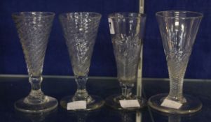 Four various short ale glasses including a wrythen-moulded example