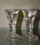 A pair of early 19th century toast master`s glasses.10cm. There is no condition report available on