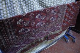 A red ground Bokhara rug and another -2 There is no condition report available on this lot.