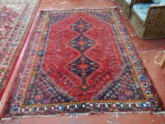 A Caucasian rug with red field 270 x 184cm A condition report is not available on this lot.