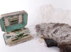 A 19th century white ostrich feather fan; together with a pale brown and cream feather fan; and a