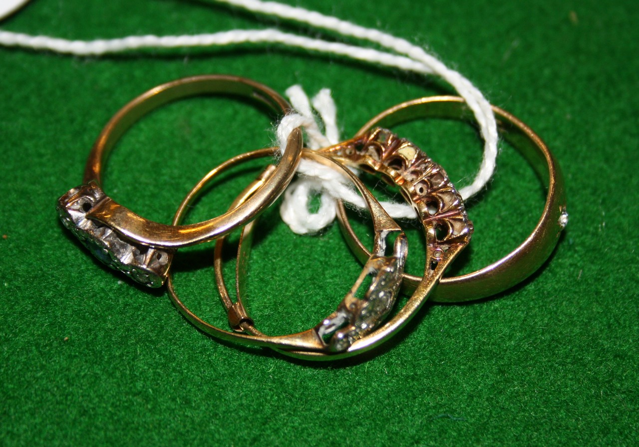 A five stone diamond ring, set with graduating old cut diamonds and eight cut diamonds,