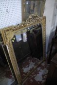 A gilt frame mirror in the Georgian style with ribbon and floral gesso wirework superstructure with