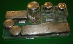 Seven electro-plate and facetted or cut glass jars or bottles from a Victorian vanity case. A
