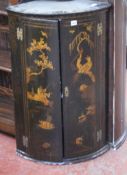 An early 18th century hanging corner cupboard with Chinoiserie decoration